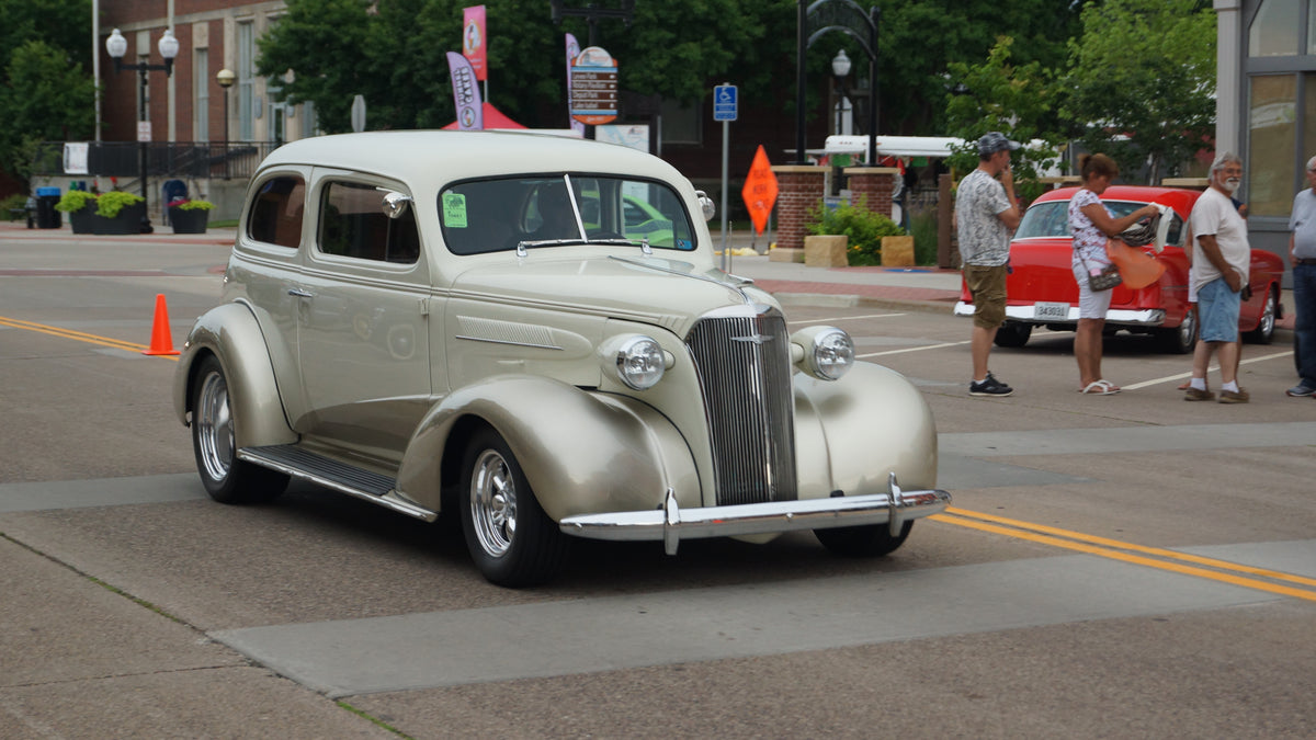 1937 Chevrolet Deluxe 2-door sedan at a car show.