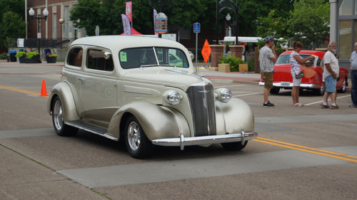 1937 Chevrolet Deluxe 2-door sedan at a car show.