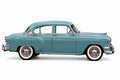 Side view of a blue 1954 Chevrolet four-door sedan on a white background.

